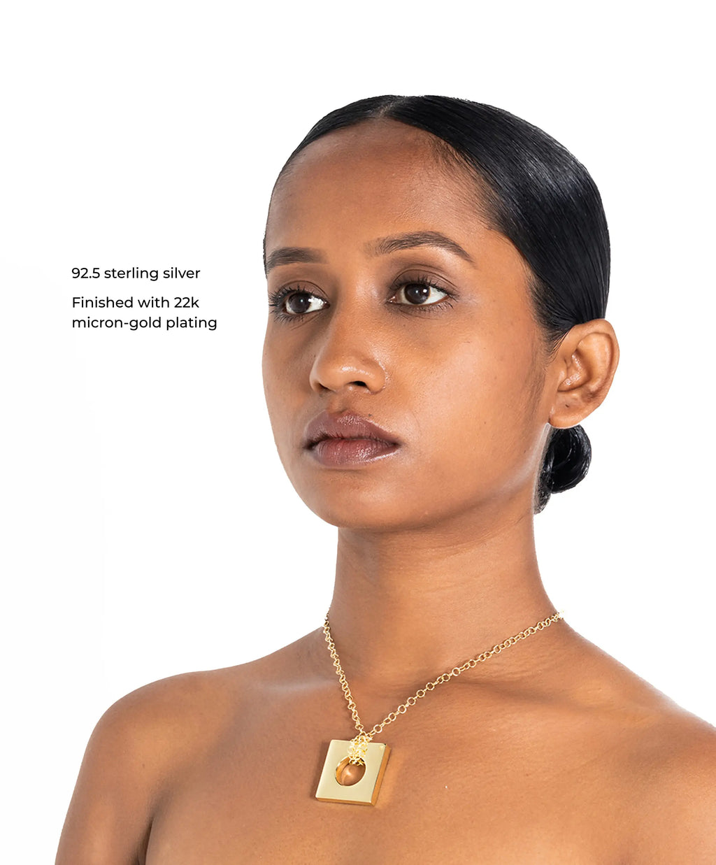 MAISON MEGH Edge Pendant Loopless jewelry with sleek, modern design featuring a polished metal pendant on a delicate chain.