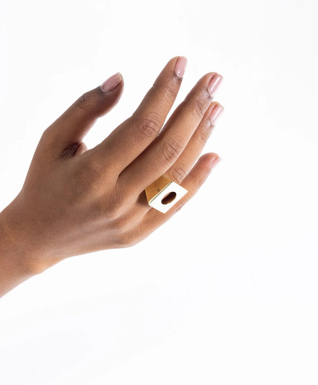 Close-up of the MAISON MEGH Edge Mega Ring jewelry piece showcasing its bold, modern design with intricate metal detailing.