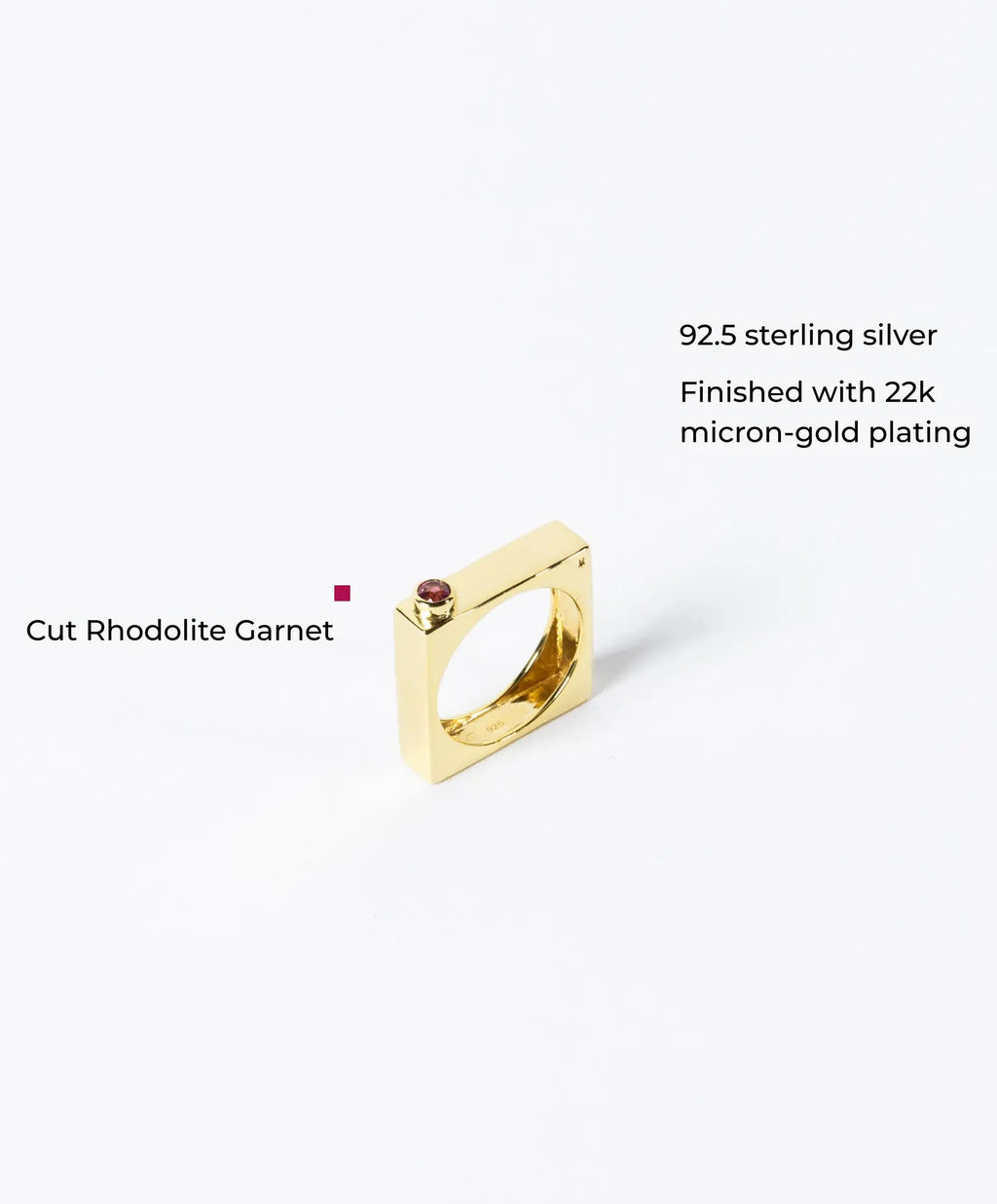 Elegant edge ring with sparkling gems from MAISON MEGH, showcasing a stylish jewelry piece with intricate design and gemstone accents.