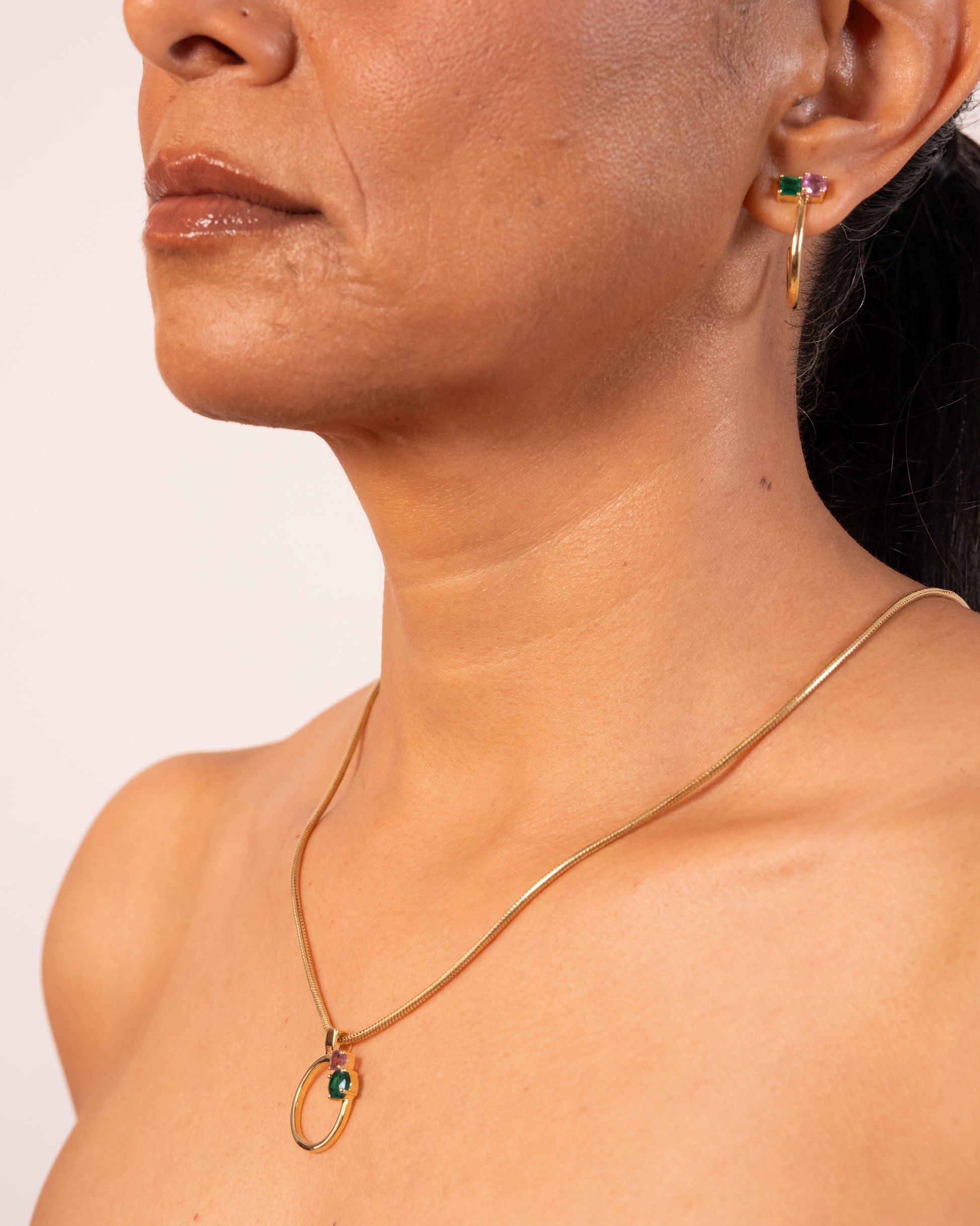 Gold MTW Duo Pendant by MAISON MEGH featuring layered circular design on a sleek chain.