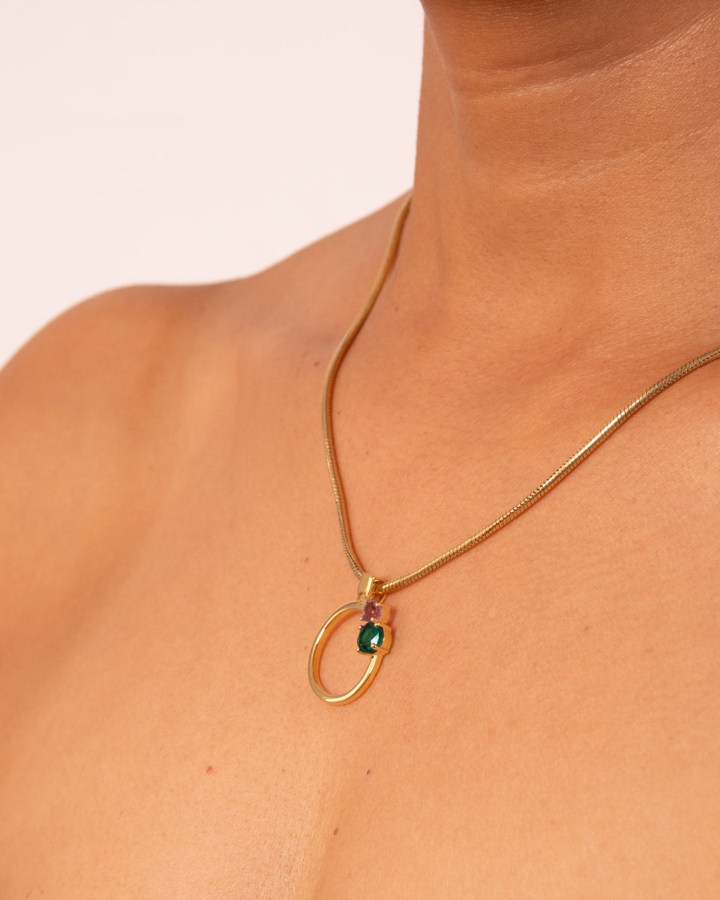 Gold MTW Duo Pendant by MAISON MEGH featuring layered circular design on a delicate chain.