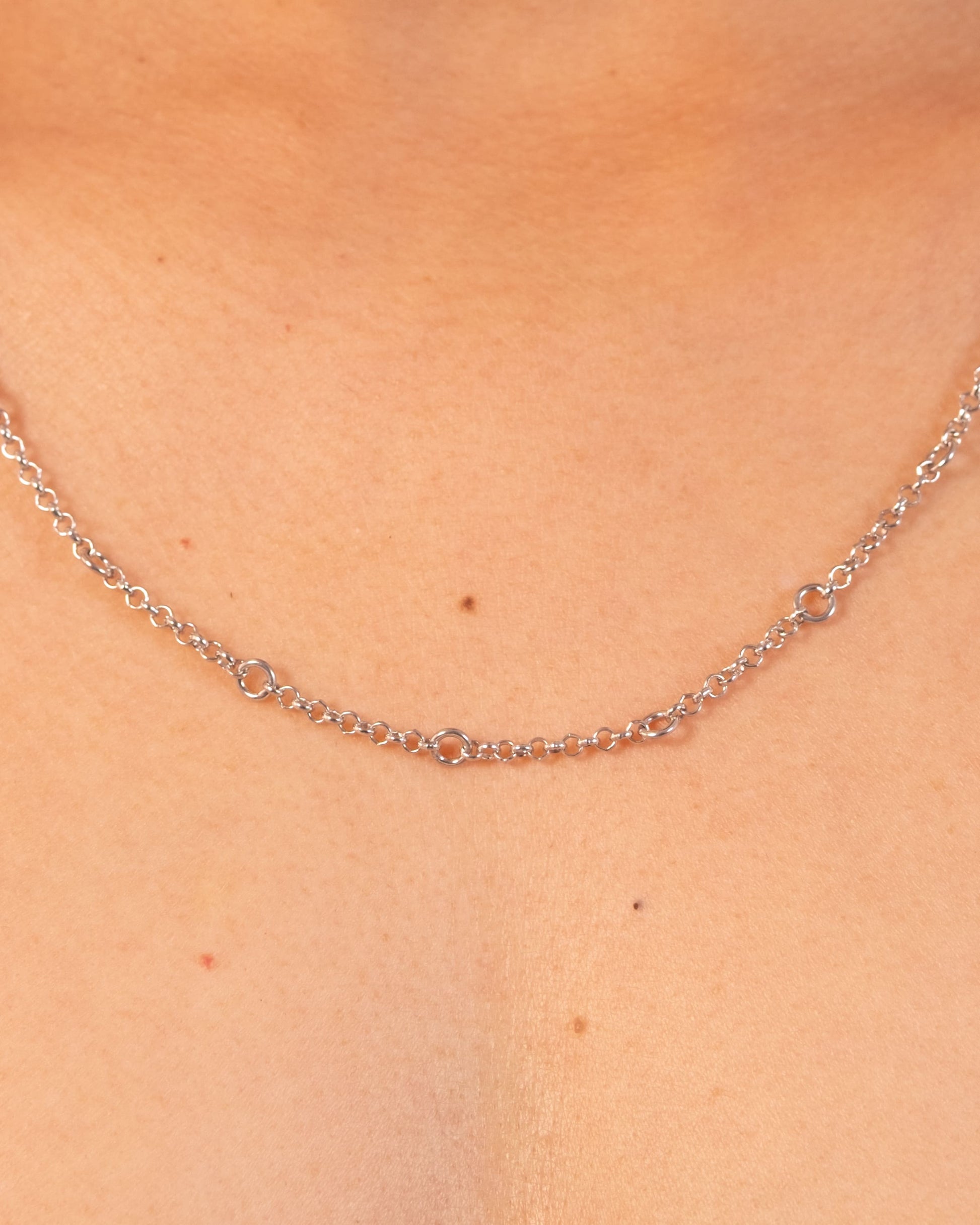 Silver Tiny Linky Chain Circle by MAISON MEGH showing close-up of delicate circular chain links.