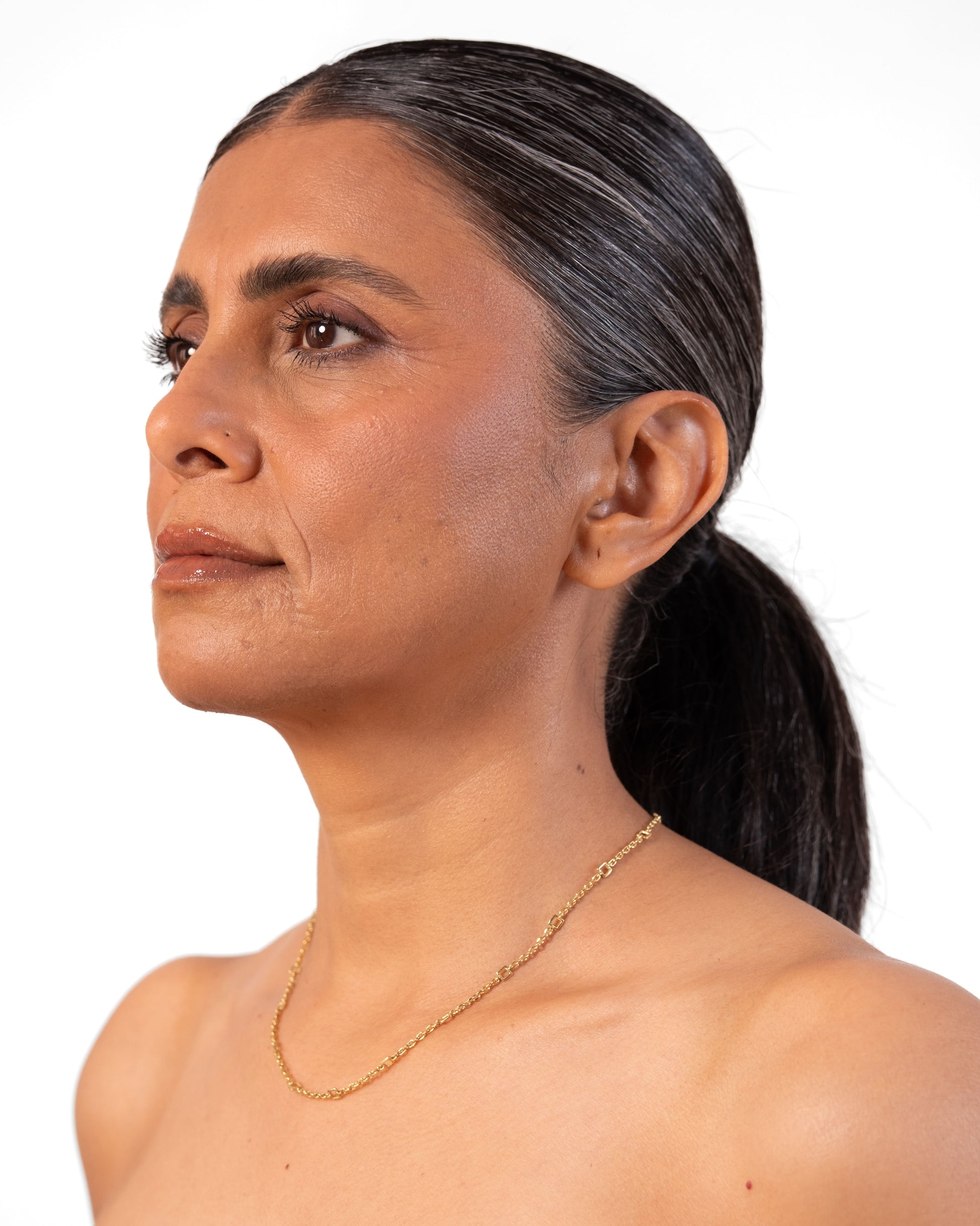 Gold Tiny Linky Chain Square by MAISON MEGH, showcasing a delicate square-link jewelry chain on a white background.